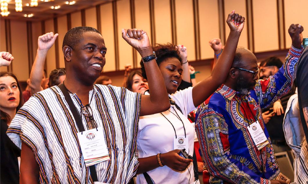 Organizers joining together in song.